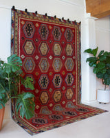 Vintage Turkish rug in a living room setting, pile rug, Turkish rug, vintage rug, portland, rug shop, bright colors, wild shaman, soft rug, bold color, Portland, Oregon, rug store, rug shop, local shop, antique rug