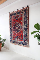 Vintage Turkish rug in living room setting, old rug, antique rug, pastel colors, faded colors, Turkish rug, vintage rug, soft rug, Portland, Oregon, rug store, rug shop, local shop