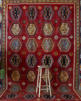 Vintage Turkish rug in a living room setting, pile rug, Turkish rug, vintage rug, portland, rug shop, bright colors, wild shaman, soft rug, bold color, Portland, Oregon, rug store, rug shop, local shop, antique rug