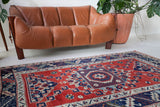 Vintage Turkish rug in living room setting, old rug, antique rug, pastel colors, faded colors, Turkish rug, vintage rug, soft rug, Portland, Oregon, rug store, rug shop, local shop