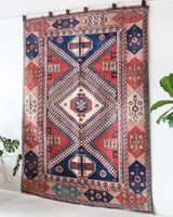 Vintage Turkish rug in living room setting, old rug, antique rug, pastel colors, faded colors, Turkish rug, vintage rug, soft rug, Portland, Oregon, rug store, rug shop, local shop, pastel colors