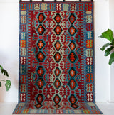 Vintage kilim rug in living room setting, bright colors, wild shaman, soft rug, bold color, Portland, Oregon, rug store, rug shop, local shop, vintage rug, modern kilim, warm colors