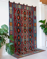 Vintage kilim rug in living room setting, bright colors, wild shaman, soft rug, bold color, Portland, Oregon, rug store, rug shop, local shop, vintage rug, modern kilim, warm colors