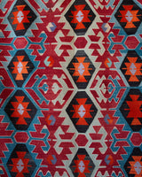 Vintage kilim rug in living room setting, bright colors, wild shaman, soft rug, bold color, Portland, Oregon, rug store, rug shop, local shop, vintage rug, modern kilim, warm colors