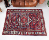 Vintage Turkish rug in a living room setting, pile rug, Turkish rug, vintage rug, portland, rug shop, bright colors, wild shaman, soft rug, bold color, Portland, Oregon, rug store, rug shop, local shop, antique rug