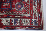 Vintage Turkish rug in a living room setting, pile rug, Turkish rug, vintage rug, portland, rug shop, bright colors, wild shaman, soft rug, bold color, Portland, Oregon, rug store, rug shop, local shop, antique rug