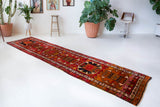 Vintage Turkish runner rug in a living room setting, pile rug, Turkish rug, vintage rug, portland, rug shop, bright colors, wild shaman, soft rug, bold color, Portland, Oregon, rug store, rug shop, local shop, antique rug