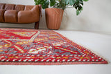Vintage Turkish rug in a living room setting, pile rug, Turkish rug, vintage rug, portland, rug shop, bright colors, wild shaman, soft rug, bold color, Portland, Oregon, rug store, rug shop, local shop, antique rug