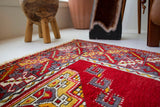 Vintage Turkish rug in a living room setting, pile rug, Turkish rug, vintage rug, portland, rug shop, bright colors, wild shaman, soft rug, bold color, Portland, Oregon, rug store, rug shop, local shop, antique rug