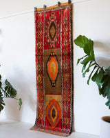 Vintage Turkish runner rug in a living room setting, pile rug, Turkish rug, vintage rug, portland, rug shop, bright colors, wild shaman, soft rug, bold color, Portland, Oregon, rug store, rug shop, local shop, antique rug