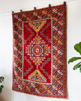 Vintage Turkish rug in a living room setting, pile rug, Turkish rug, vintage rug, portland, rug shop, bright colors, wild shaman, soft rug, bold color, Portland, Oregon, rug store, rug shop, local shop, antique rug