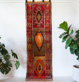 Vintage Turkish runner rug in a living room setting, pile rug, Turkish rug, vintage rug, portland, rug shop, bright colors, wild shaman, soft rug, bold color, Portland, Oregon, rug store, rug shop, local shop, antique rug