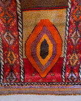 Vintage Turkish runner rug in a living room setting, pile rug, Turkish rug, vintage rug, portland, rug shop, bright colors, wild shaman, soft rug, bold color, Portland, Oregon, rug store, rug shop, local shop, antique rug