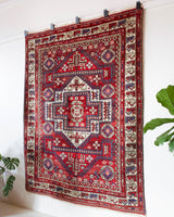 Vintage Turkish rug in a living room setting, pile rug, Turkish rug, vintage rug, portland, rug shop, bright colors, wild shaman, soft rug, bold color, Portland, Oregon, rug store, rug shop, local shop, antique rug