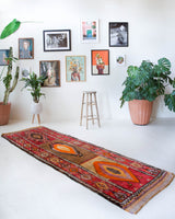 Vintage Turkish runner rug in a living room setting, pile rug, Turkish rug, vintage rug, portland, rug shop, bright colors, wild shaman, soft rug, bold color, Portland, Oregon, rug store, rug shop, local shop, antique rug