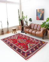 Vintage Turkish rug in a living room setting, pile rug, Turkish rug, vintage rug, portland, rug shop, bright colors, wild shaman, soft rug, bold color, Portland, Oregon, rug store, rug shop, local shop, antique rug