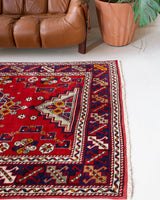 Vintage Turkish rug in a living room setting, pile rug, Turkish rug, vintage rug, portland, rug shop, bright colors, wild shaman, soft rug, bold color, Portland, Oregon, rug store, rug shop, local shop, antique rug