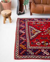 Vintage Turkish rug in a living room setting, pile rug, Turkish rug, vintage rug, portland, rug shop, bright colors, wild shaman, soft rug, bold color, Portland, Oregon, rug store, rug shop, local shop, antique rug