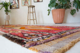Vintage Turkish runner rug in a living room setting, pile rug, Turkish rug, vintage rug, portland, rug shop, bright colors, wild shaman, soft rug, bold color, Portland, Oregon, rug store, rug shop, local shop, antique rug