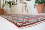 Vintage Turkish runner rug in a living room setting, pile rug, Turkish rug, vintage rug, portland, rug shop, bright colors, wild shaman, soft rug, bold color, Portland, Oregon, rug store, rug shop, local shop, antique rug