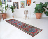 Vintage Turkish runner rug in a living room setting, pile rug, Turkish rug, vintage rug, portland, rug shop, bright colors, wild shaman, soft rug, bold color, Portland, Oregon, rug store, rug shop, local shop, antique rug
