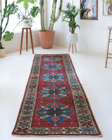 Vintage Turkish runner rug in a living room setting, pile rug, Turkish rug, vintage rug, portland, rug shop, bright colors, wild shaman, soft rug, bold color, Portland, Oregon, rug store, rug shop, local shop, antique rug