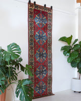 Vintage Turkish runner rug in a living room setting, pile rug, Turkish rug, vintage rug, portland, rug shop, bright colors, wild shaman, soft rug, bold color, Portland, Oregon, rug store, rug shop, local shop, antique rug