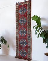 Vintage Turkish runner rug in a living room setting, pile rug, Turkish rug, vintage rug, portland, rug shop, bright colors, wild shaman, soft rug, bold color, Portland, Oregon, rug store, rug shop, local shop, antique rug