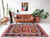 Vintage Turkish rug in a living room setting, pile rug, Turkish rug, vintage rug, portland, rug shop, bright colors, wild shaman, soft rug, bold color, Portland, Oregon, rug store, rug shop, local shop, antique rug