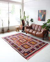 Vintage Turkish rug in a living room setting, pile rug, Turkish rug, vintage rug, portland, rug shop, bright colors, wild shaman, soft rug, bold color, Portland, Oregon, rug store, rug shop, local shop, antique rug
