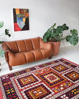 Vintage Turkish rug in a living room setting, pile rug, Turkish rug, vintage rug, portland, rug shop, bright colors, wild shaman, soft rug, bold color, Portland, Oregon, rug store, rug shop, local shop, antique rug