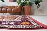 Vintage Turkish rug in a living room setting, pile rug, Turkish rug, vintage rug, portland, rug shop, bright colors, wild shaman, soft rug, bold color, Portland, Oregon, rug store, rug shop, local shop, antique rug