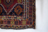 Vintage Turkish runner rug in a living room setting, pile rug, Turkish rug, vintage rug, portland, rug shop, bright colors, wild shaman, soft rug, bold color, Portland, Oregon, rug store, rug shop, local shop, antique rug