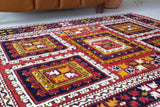 Vintage Turkish rug in a living room setting, pile rug, Turkish rug, vintage rug, portland, rug shop, bright colors, wild shaman, soft rug, bold color, Portland, Oregon, rug store, rug shop, local shop, antique rug