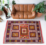 Vintage Turkish rug in a living room setting, pile rug, Turkish rug, vintage rug, portland, rug shop, bright colors, wild shaman, soft rug, bold color, Portland, Oregon, rug store, rug shop, local shop, antique rug