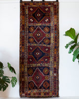Vintage Turkish runner rug in a living room setting, pile rug, Turkish rug, vintage rug, portland, rug shop, bright colors, wild shaman, soft rug, bold color, Portland, Oregon, rug store, rug shop, local shop, antique rug