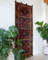 Vintage Turkish runner rug in a living room setting, pile rug, Turkish rug, vintage rug, portland, rug shop, bright colors, wild shaman, soft rug, bold color, Portland, Oregon, rug store, rug shop, local shop, antique rug