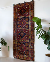 Vintage Turkish runner rug in a living room setting, pile rug, Turkish rug, vintage rug, portland, rug shop, bright colors, wild shaman, soft rug, bold color, Portland, Oregon, rug store, rug shop, local shop, antique rug