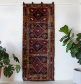 Vintage Turkish runner rug in a living room setting, pile rug, Turkish rug, vintage rug, portland, rug shop, bright colors, wild shaman, soft rug, bold color, Portland, Oregon, rug store, rug shop, local shop, antique rug