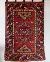 Vintage Turkish rug in a living room setting, pile rug, Turkish rug, vintage rug, portland, rug shop, bright colors, wild shaman, soft rug, bold color, Portland, Oregon, rug store, rug shop, local shop, antique rug
