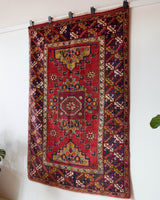 Vintage Turkish rug in a living room setting, pile rug, Turkish rug, vintage rug, portland, rug shop, bright colors, wild shaman, soft rug, bold color, Portland, Oregon, rug store, rug shop, local shop, antique rug