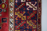 Vintage Turkish rug in a living room setting, pile rug, Turkish rug, vintage rug, portland, rug shop, bright colors, wild shaman, soft rug, bold color, Portland, Oregon, rug store, rug shop, local shop, antique rug