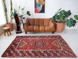 Vintage Turkish rug in a living room setting, pile rug, Turkish rug, vintage rug, portland, rug shop, bright colors, wild shaman, soft rug, bold color, Portland, Oregon, rug store, rug shop, local shop, antique rug