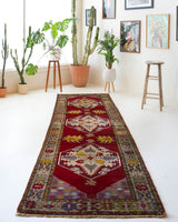 Vintage Turkish runner rug in a living room setting, pile rug, Turkish rug, vintage rug, portland, rug shop, bright colors, wild shaman, soft rug, bold color, Portland, Oregon, rug store, rug shop, local shop, antique rug