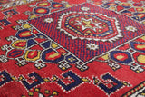 Vintage Turkish rug in a living room setting, pile rug, Turkish rug, vintage rug, portland, rug shop, bright colors, wild shaman, soft rug, bold color, Portland, Oregon, rug store, rug shop, local shop, antique rug
