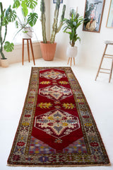 Vintage Turkish runner rug in a living room setting, pile rug, Turkish rug, vintage rug, portland, rug shop, bright colors, wild shaman, soft rug, bold color, Portland, Oregon, rug store, rug shop, local shop, antique rug