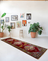 Vintage Turkish runner rug in a living room setting, pile rug, Turkish rug, vintage rug, portland, rug shop, bright colors, wild shaman, soft rug, bold color, Portland, Oregon, rug store, rug shop, local shop, antique rug