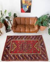Vintage Turkish rug in a living room setting, pile rug, Turkish rug, vintage rug, portland, rug shop, bright colors, wild shaman, soft rug, bold color, Portland, Oregon, rug store, rug shop, local shop, antique rug