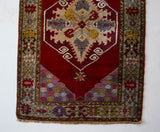Vintage Turkish runner rug in a living room setting, pile rug, Turkish rug, vintage rug, portland, rug shop, bright colors, wild shaman, soft rug, bold color, Portland, Oregon, rug store, rug shop, local shop, antique rug