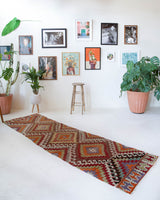 Vintage Turkish runner rug in living room setting, old rug, antique rug, pastel colors, faded colors, Turkish rug, vintage rug, soft rug, Portland, Oregon, rug store, rug shop, local shop